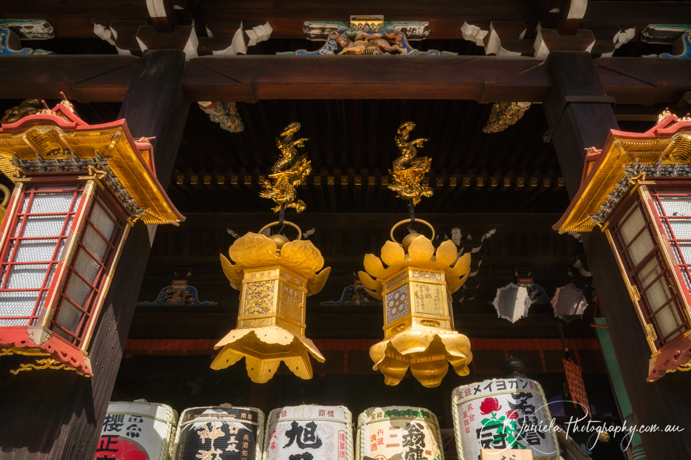 Poet's Festival Kitano Tenmangu Shrine in Kyoto Architectural details with golden lanterns